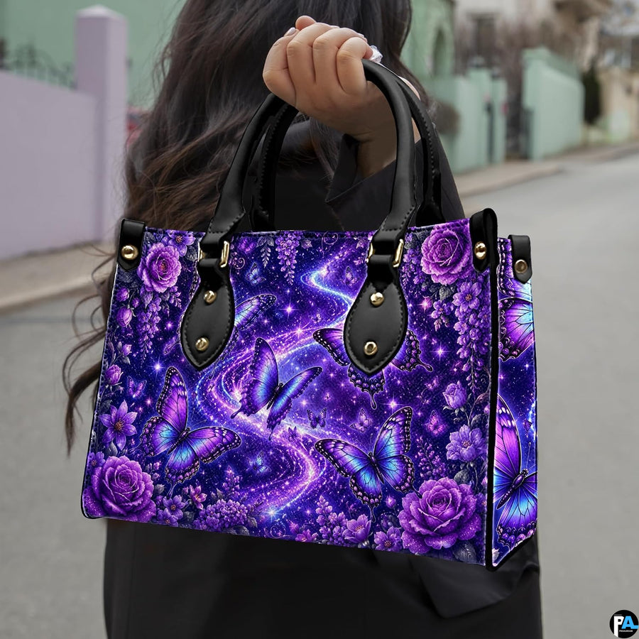 Outdoor street perspective showing purple butterfly artwork held by pedestrian along town sidewalk.