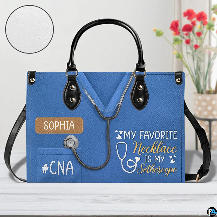 Angled perspective showing blue scrub uniform artwork on structured handbag