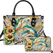 Front view of mosaic hummingbird handbag and matching wallet featuring golden sunflowers and lavender flora.