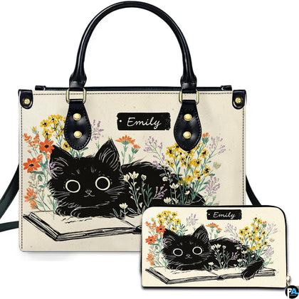 Front view of literary black kitten on open book handbag and matching wallet set with wildflowers