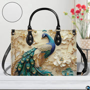 Front view of peacock floral design handbag with long strap
