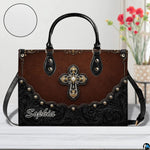 Top angle view displaying carrying handles and main zippered opening of cross handbag.