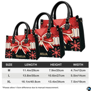 Interior compartment view of Christmas bow handbag showing open storage layout.