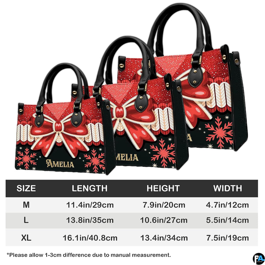 Interior compartment view of Christmas bow handbag showing open storage layout.