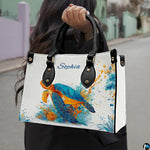 Angled front view displaying the swimming turquoise sea turtle and radiating splatter paint art.