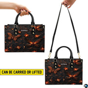 Carrying options demonstration illustrating handheld and shoulder wear for the firefly handbag.