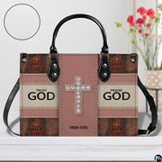 Front view of faith crystal cross handbag showing blush mauve panel and crocodile textures.