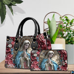 Pair arrangement of the praying Virgin Mary floral print set beside indoor green foliage.