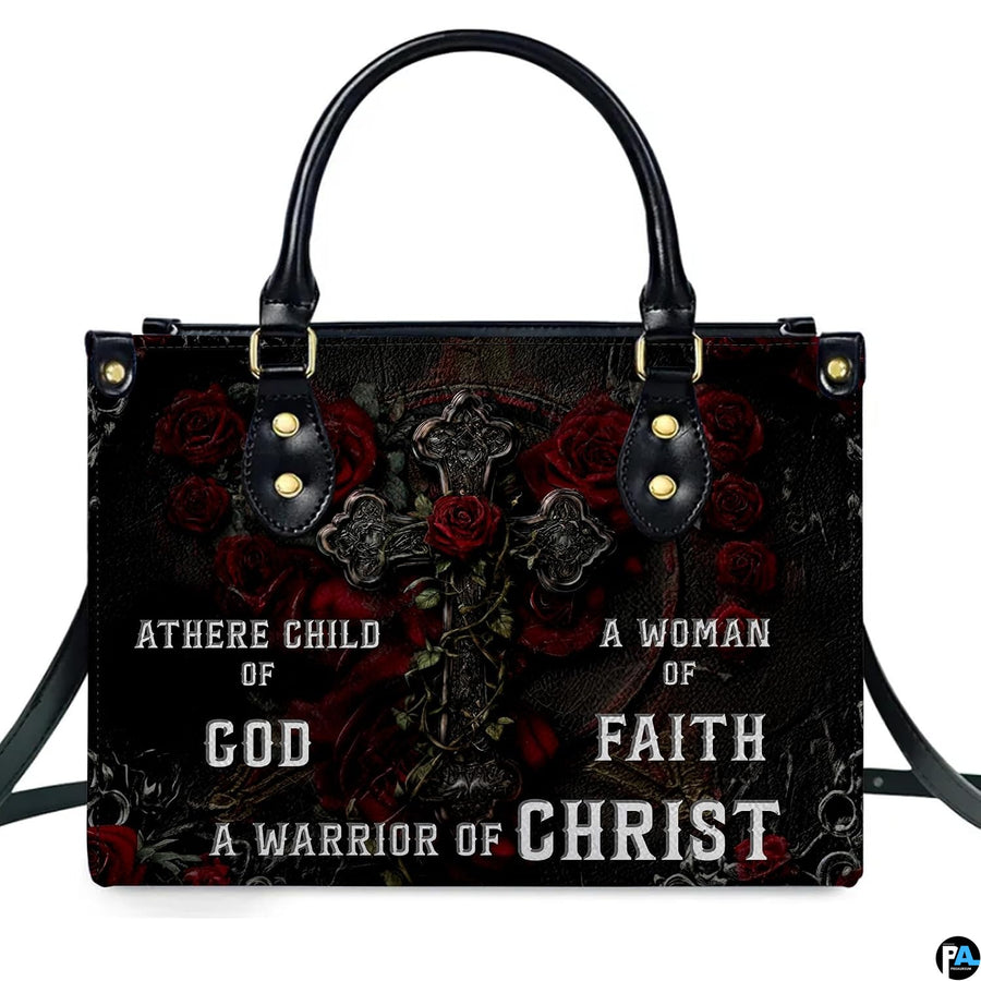 Angled perspective view of gothic cross handbag highlighting rose petals and filigree artwork.