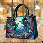 Handbag standing upright on wooden tabletop in softly lit indoor room.