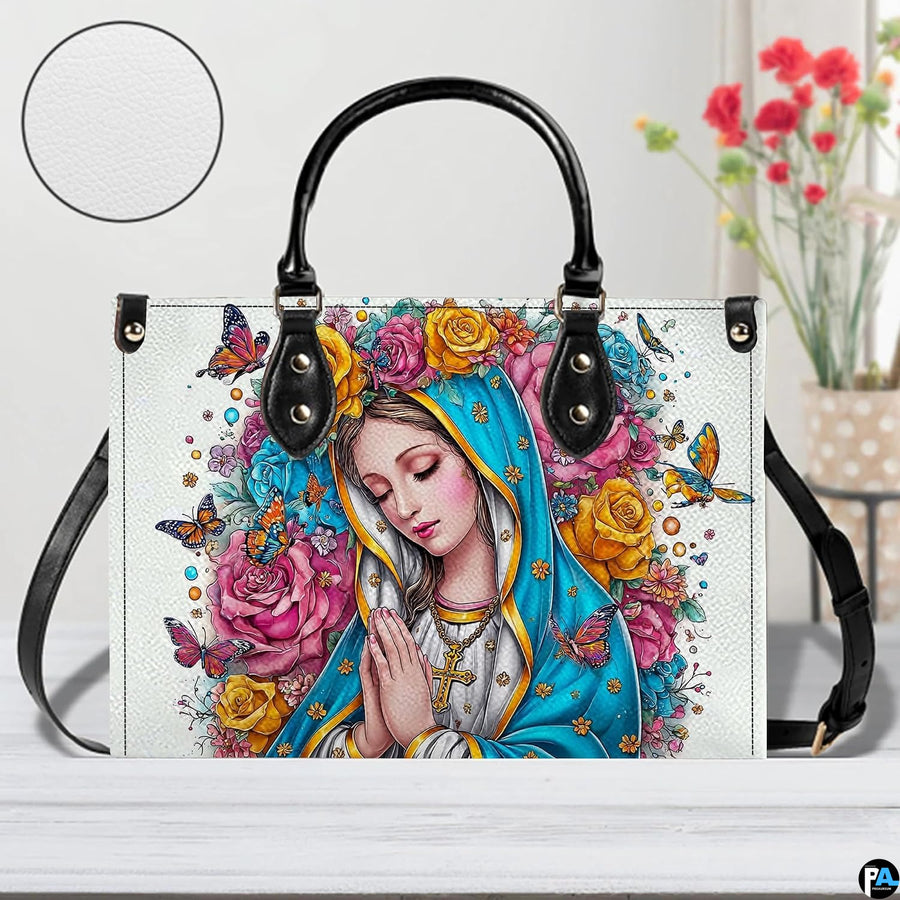Front view of Virgin Mary floral halo handbag with inset circle highlighting textured surface finish.