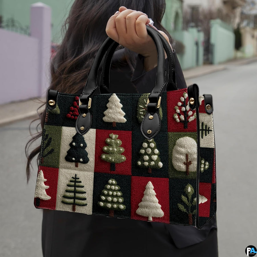 Lifestyle view of crimson and green holiday tree patchwork print item held in an outdoor setting