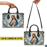 Lifestyle display of white doves Madonna handbag carried by model showing artwork and scale