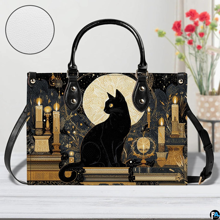 Straight-on studio view of black cat candles art highlighting detailed golden surface texture.