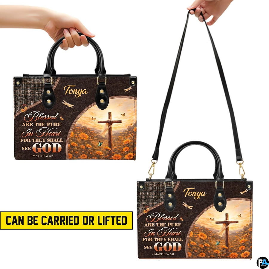 Top view showing black carrying handles and main zippered opening of wooden cross purse.