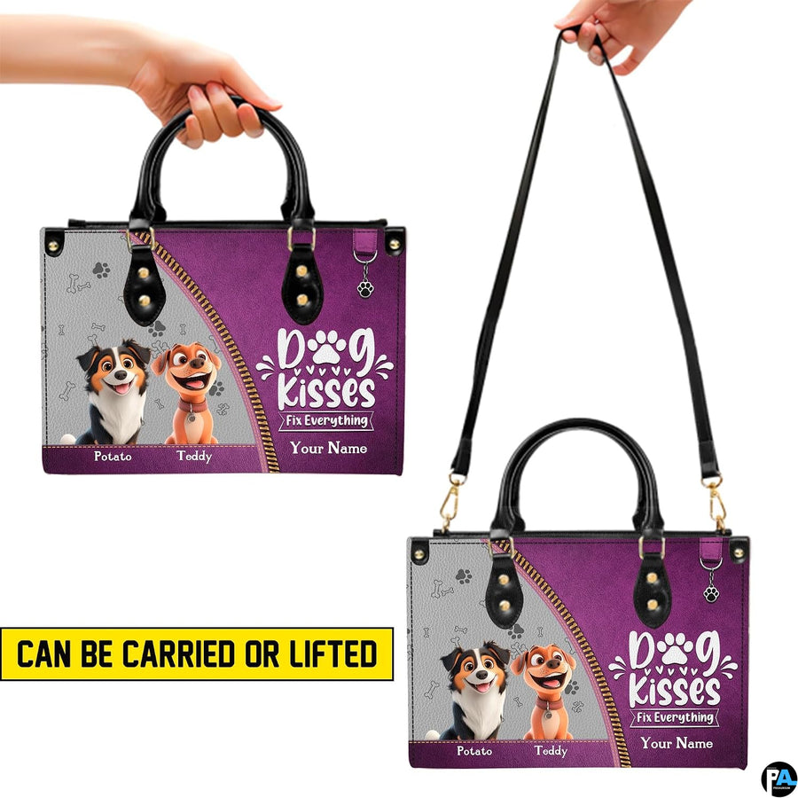 Close-up front view of animated dogs and diagonal color-block artwork on structured tote handbag