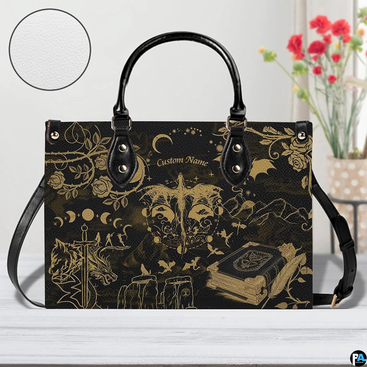 Golden dragon handbag and wallet displayed on wooden table before indoor plants.