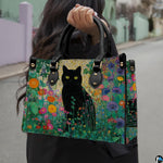 Black cat garden art design showcased outdoors along a sunlit paved walkway.