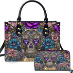 Gothic jeweled baroque skull floral handbag and matching wallet set on white background.
