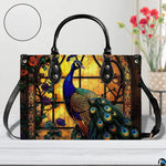 Blue peacock handbag with amber arched window and long black strap
