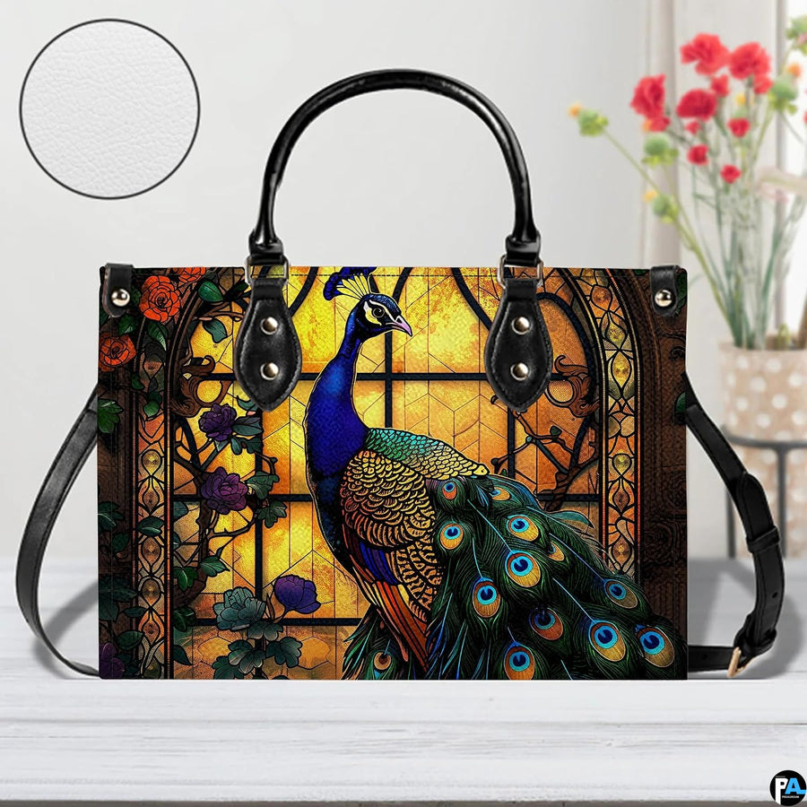 Blue peacock handbag with amber arched window and long black strap