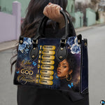 Outdoor pedestrian holding an accessory showcasing floral bible verse art during a daytime stroll.