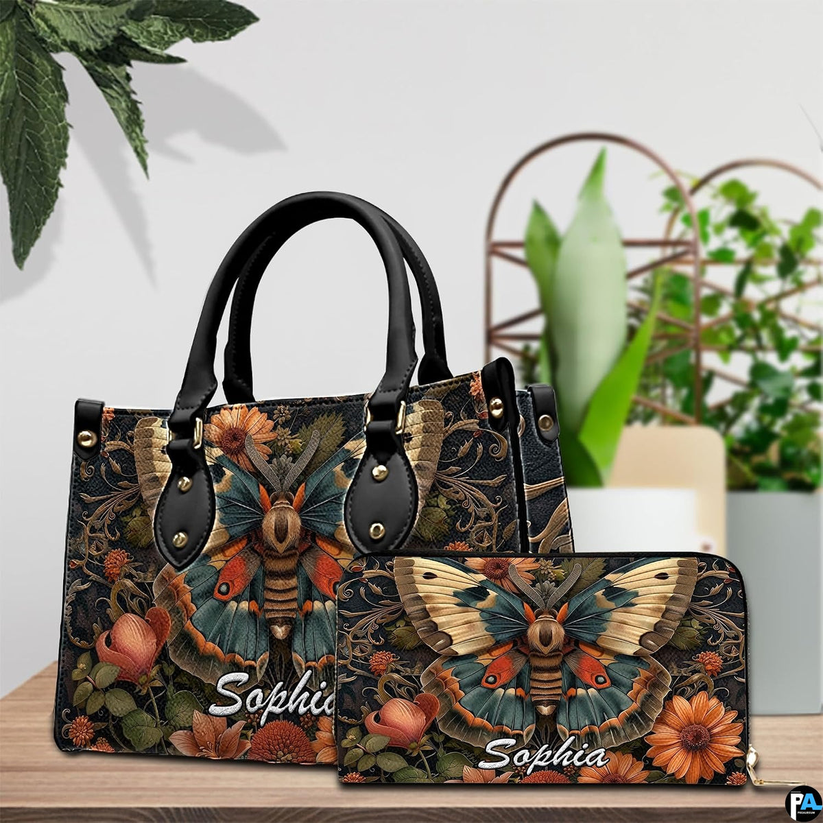 Front close-up view of handbag showing cecropia moth artwork