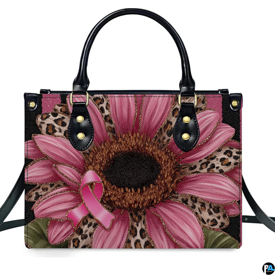 Studio perspective displaying front view of pink sunflower art accessory showcasing leopard petals.