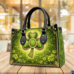 Angled shamrock handbag with glowing green and gold artwork
