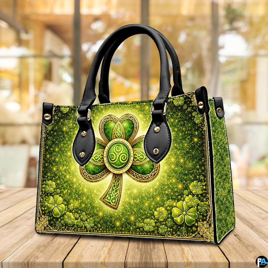 Angled shamrock handbag with glowing green and gold artwork