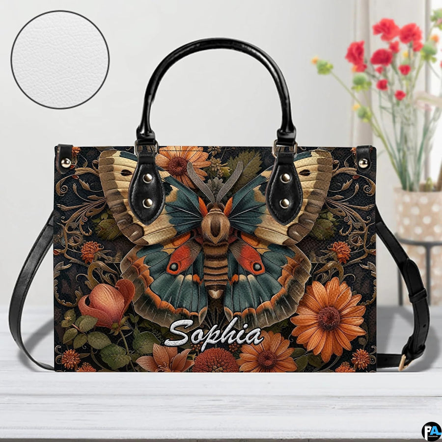 Close-up front view of matching vintage moth zippered wallet