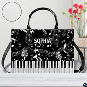 Tabletop presentation of musical artwork positioned beside floral vase and circular detail inset.
