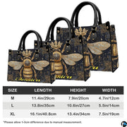 Back view of queen bee handbag displaying black background with golden damask pattern.