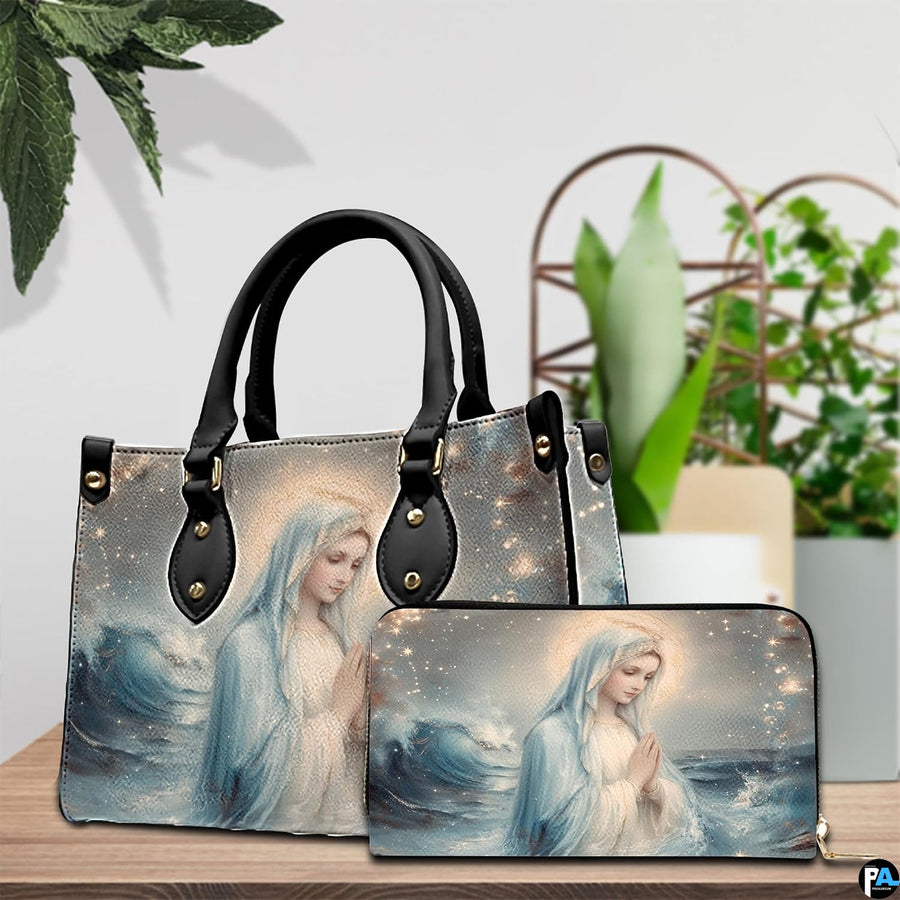 Our Lady Star of the Sea handbag and matching zippered wallet displayed on wooden table.