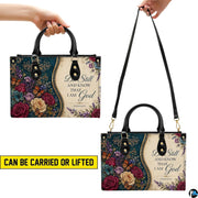 Interior compartments and zippered pocket organization of teal floral damask purse.