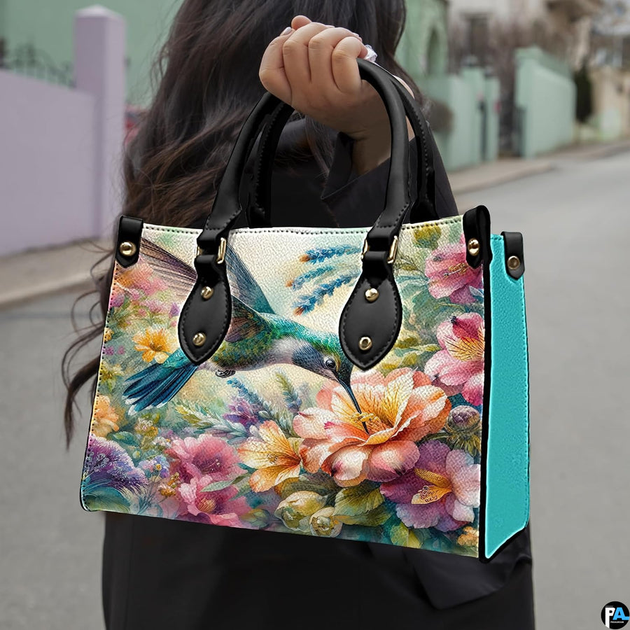 Angled display of watercolor floral purse shown alongside coordinating zippered companion wallet.