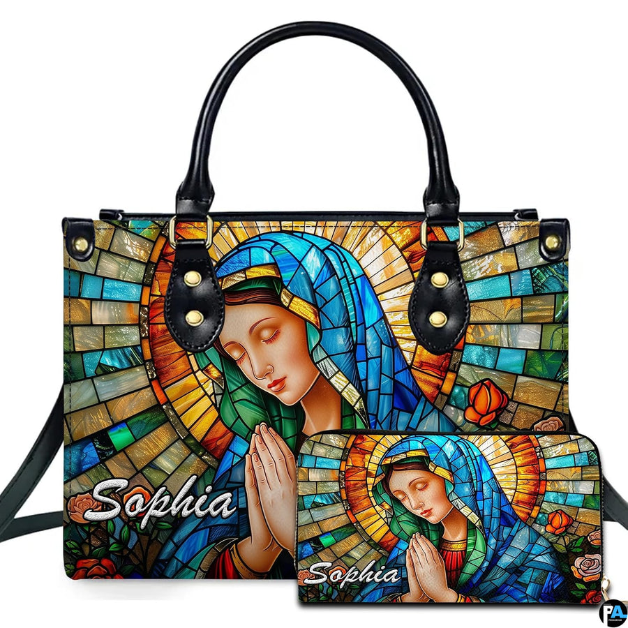 Front studio shot of praying holy mother mosaic artwork across matching two-piece ensemble on white background.