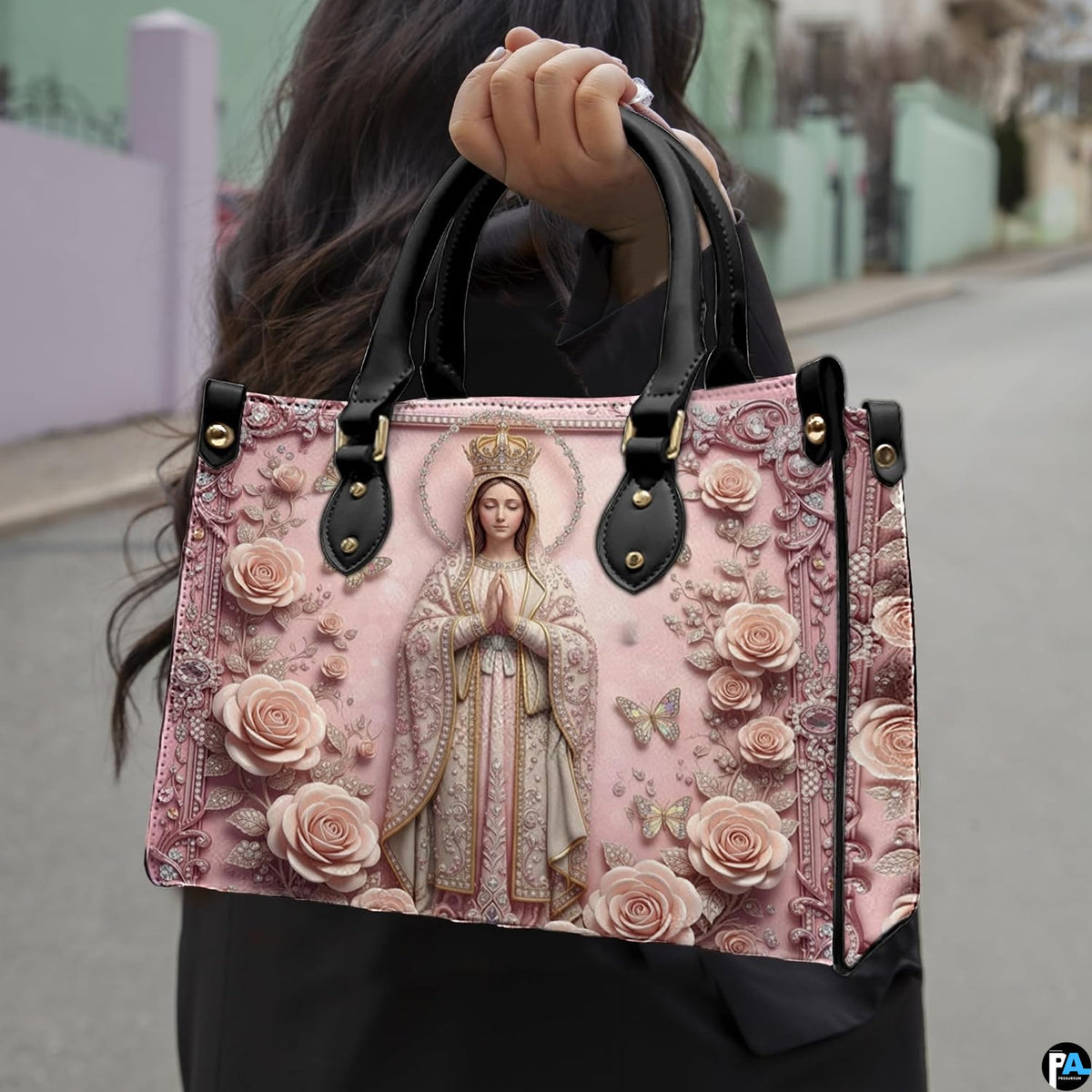 Lifestyle display of Virgin Mary handbag carried by model showing scale and devotional artwork