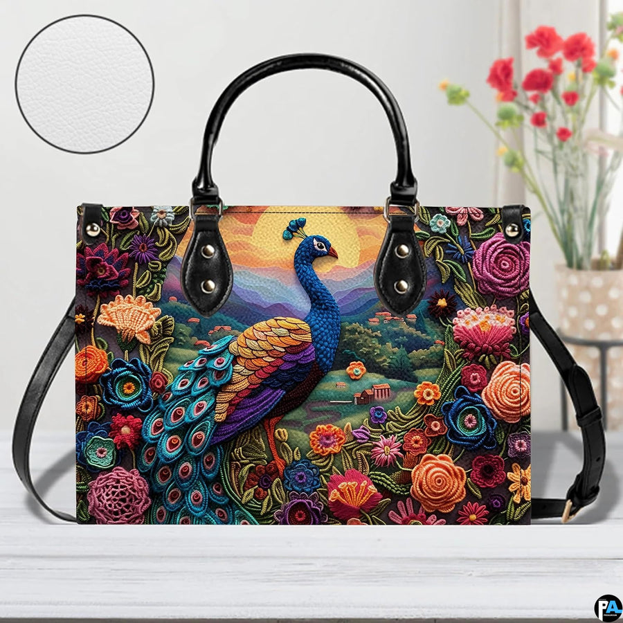 Peacock handbag with colorful flowers, layered mountains, and golden sun