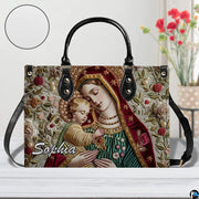 Madonna and Child sacred tapestry handbag displayed with round texture detail inset