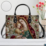 Madonna and Child sacred tapestry handbag displayed with round texture detail inset