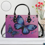Interior compartment view of butterfly handbag showing inner lining and organization.