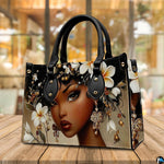 Afrocentric portrait artwork with white plumeria floral details showcased in a warm interior café setting.