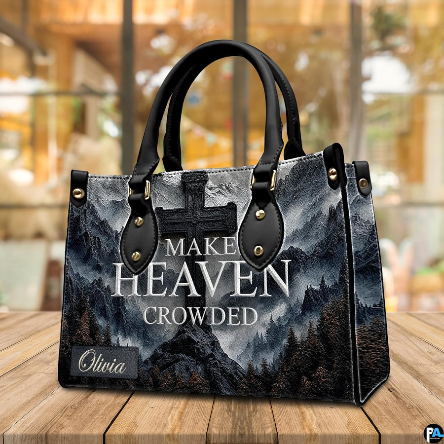 Close-up front view of stone cross on rocky mountain peak on structured tote handbag