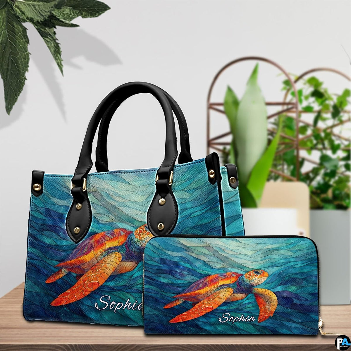 Lifestyle model display showing the mosaic sea turtle handbag carried over the shoulder.