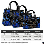 Lifestyle display showing royal blue peony handbag paired with matching coordinating wallet.