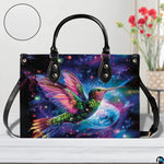 Handbag displayed in indoor setting with floral arrangement and circular texture close-up inset.