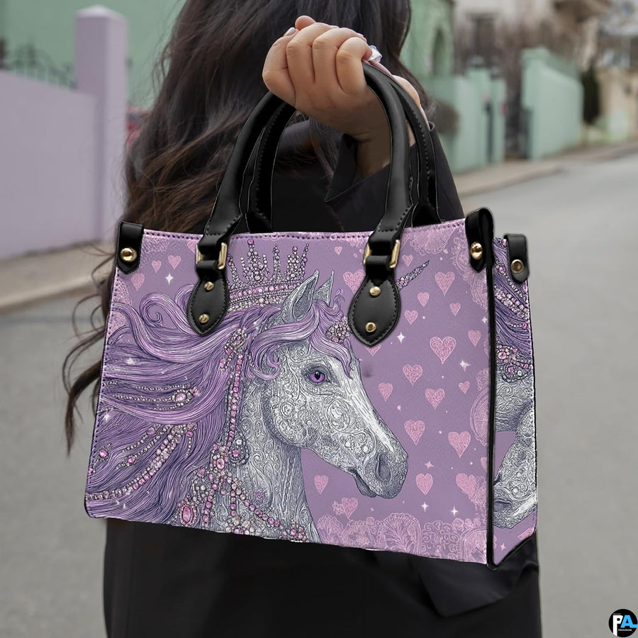 Front view of unicorn handbag displaying detailed tiara crown and flowing violet mane.