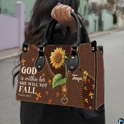 Side profile showing structured silhouette and textured brown finish of sunflower handbag.
