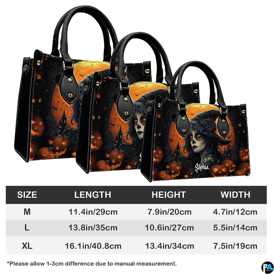 Halloween witch sugar skull pumpkin handbag shown alone on white background.